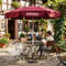 Printed small parasol in restaurant garden Printed small parasol in restaurant garden